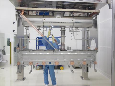 Inspecting one of the cavity mounts in a HIE-ISOLDE cryomodule